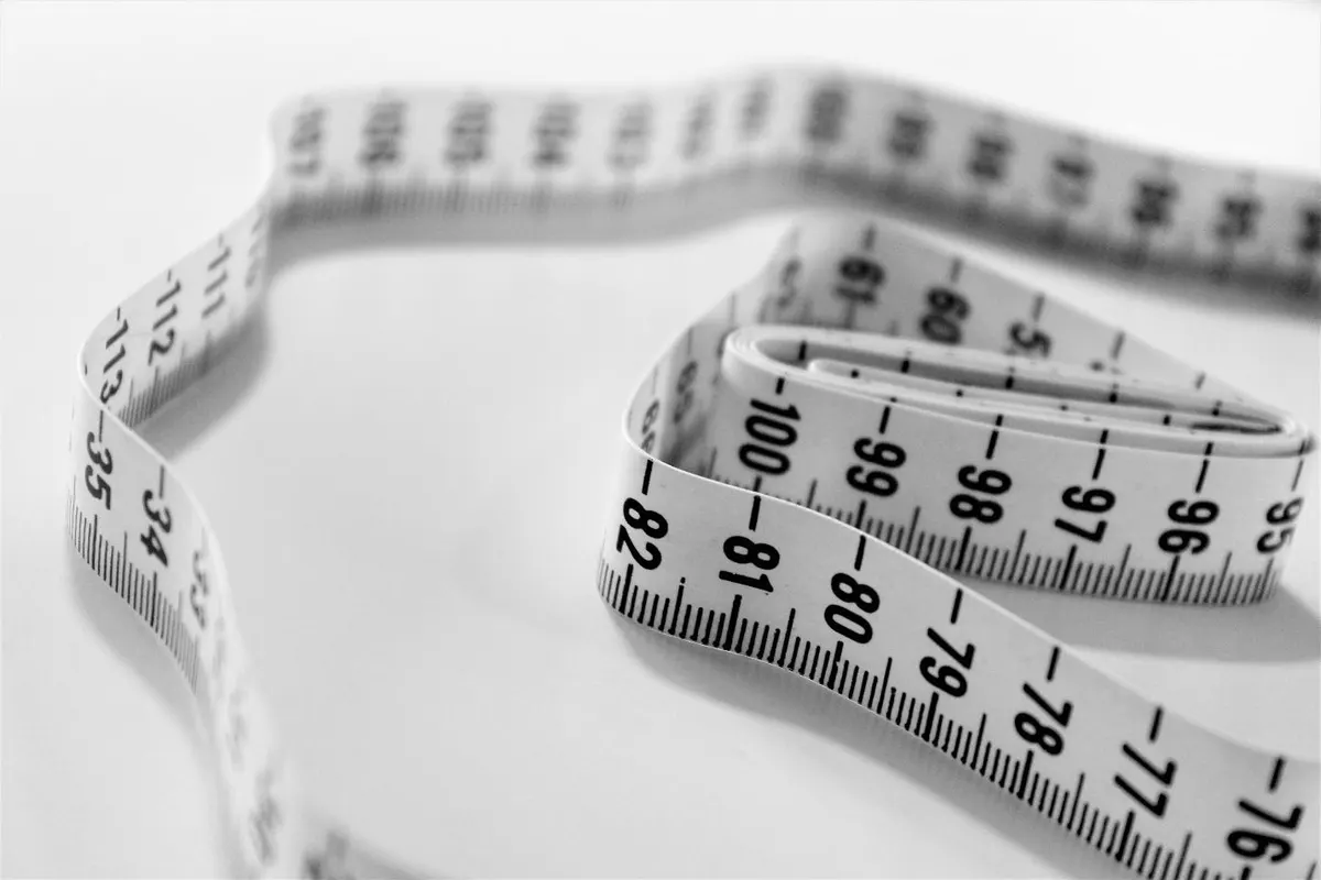 A picture containing text, measuring stick, indoorDescription automatically generated